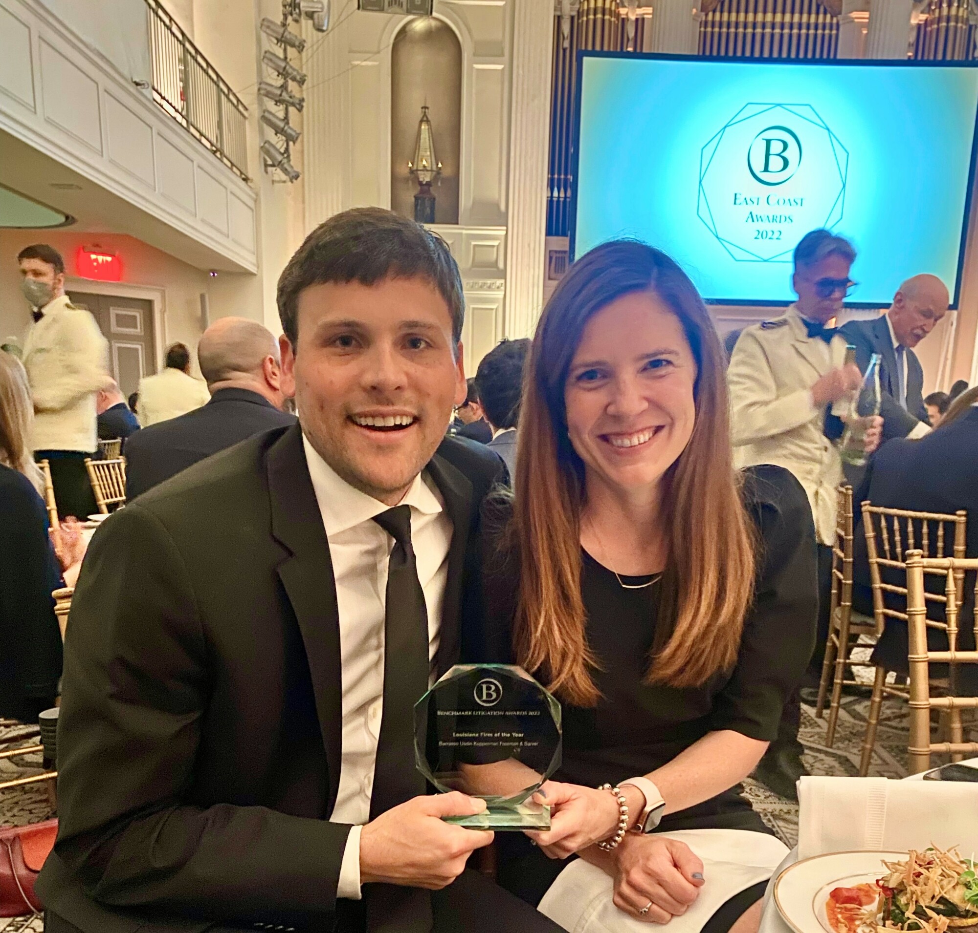 Lon LeSueur and Janelle Sharer with Benchmark 2022 Louisiana Firm of the Year Award